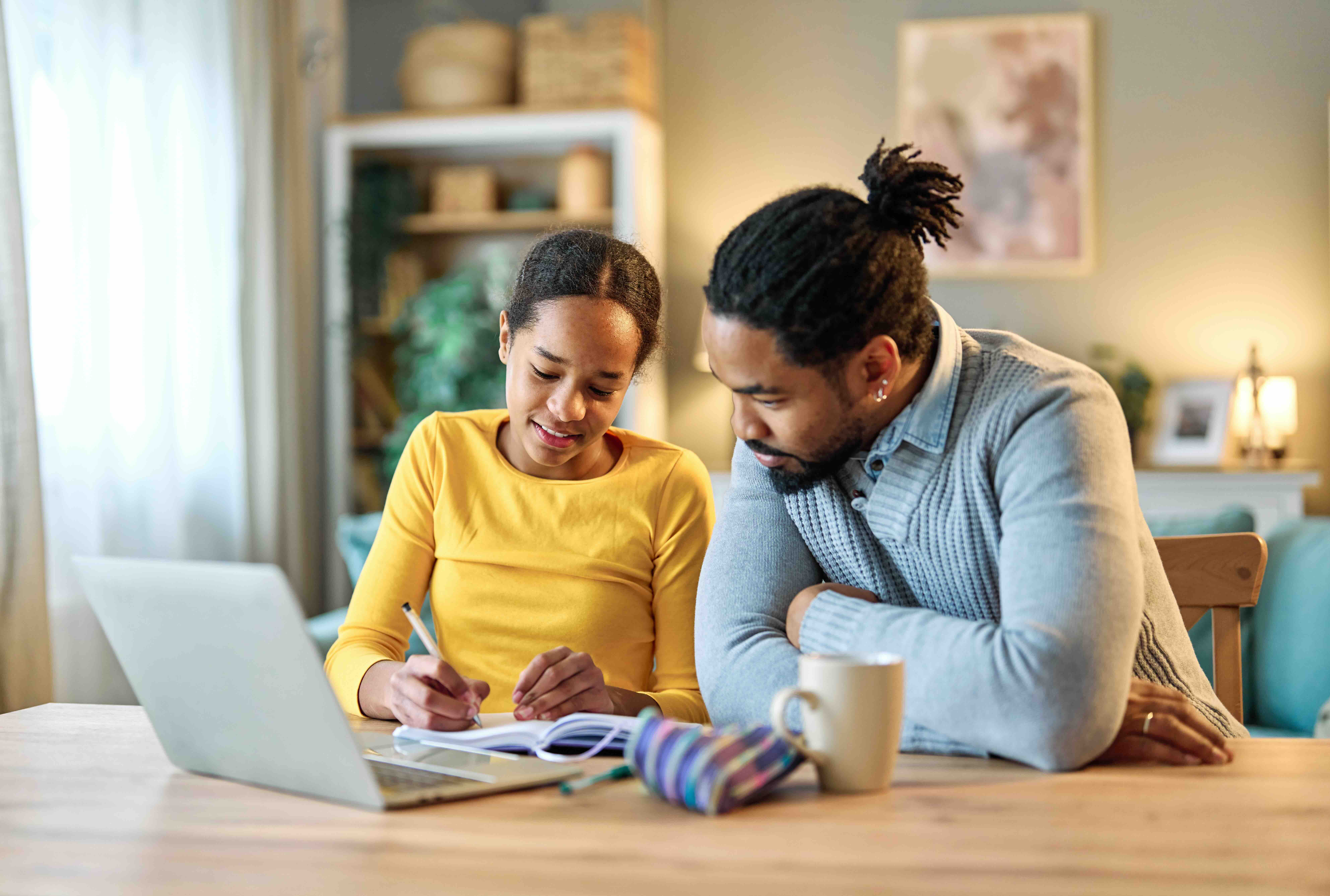 father child home family homework daughter girl cheerful teenage parent education laptop teen teaching childhood man learning together school computer internet teacher tutor black